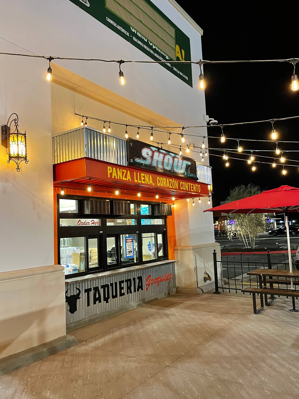 Taqueria storefront at night