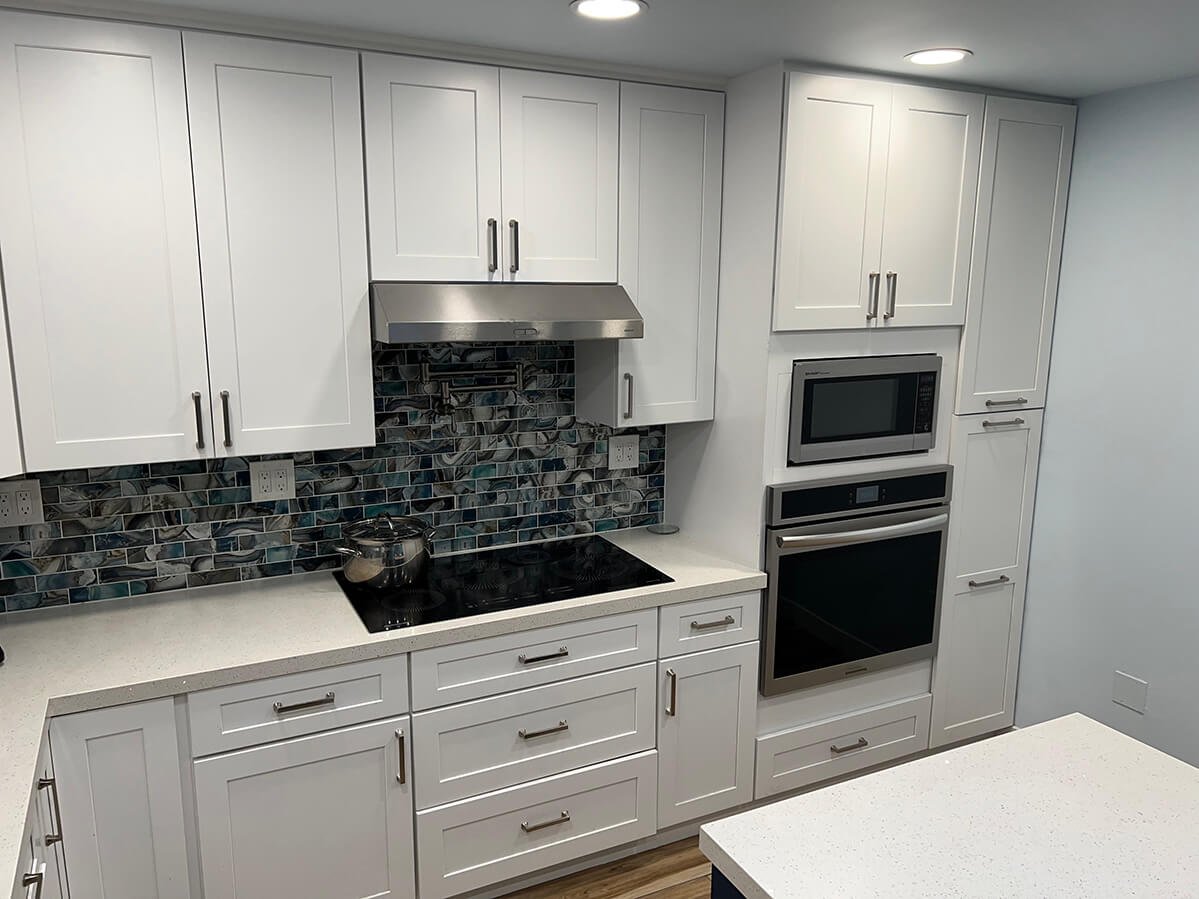White kitchen with glass tile backsplash